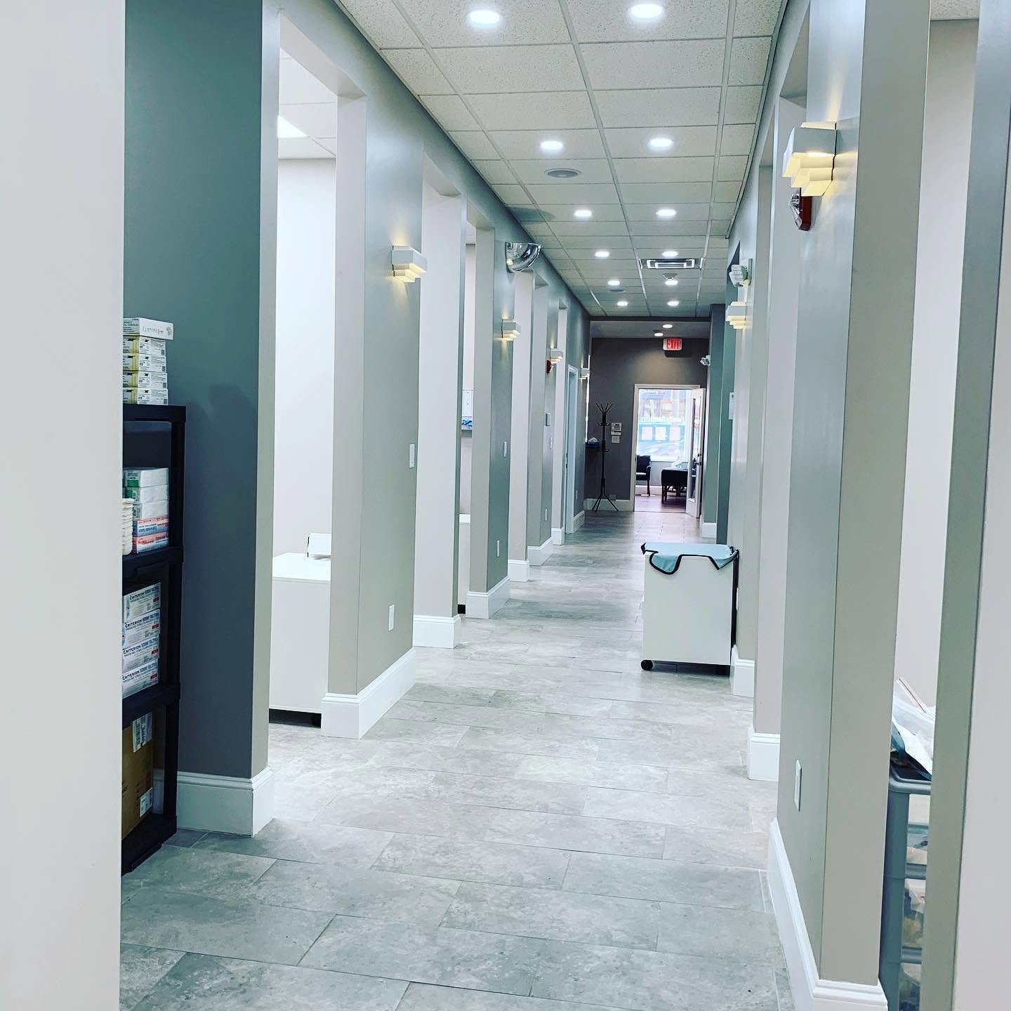 Bright, modern hallway inside United Dental in Lowell, MA